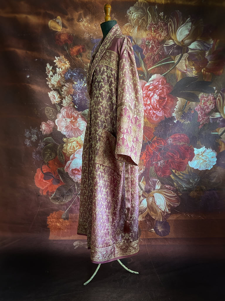 Rose pink and platinum lightweight luxury silk wrapper robe with wide sleeves, large patch pockets and tassel sash. Bohemian style created from antique and vintage textiles by the Pavilion Parade studio.
