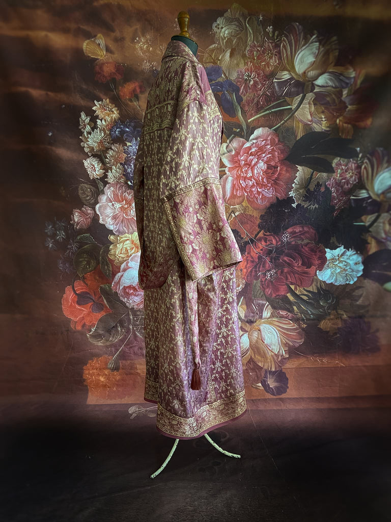 Rose pink and platinum lightweight luxury silk wrapper robe with wide sleeves, large patch pockets and tassel sash. Bohemian style created from antique and vintage textiles by the Pavilion Parade studio.