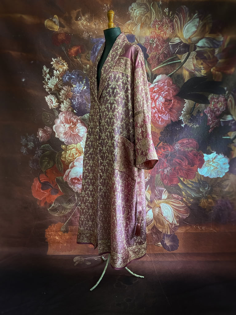 Rose pink and platinum lightweight luxury silk wrapper robe with wide sleeves, large patch pockets and tassel sash. Bohemian style created from antique and vintage textiles by the Pavilion Parade studio.