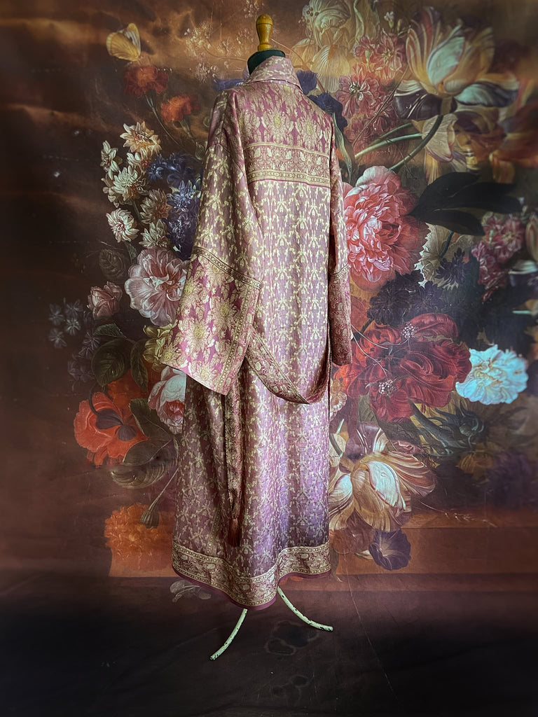 Rose pink and platinum lightweight luxury silk wrapper robe with wide sleeves, large patch pockets and tassel sash. Bohemian style created from antique and vintage textiles by the Pavilion Parade studio.