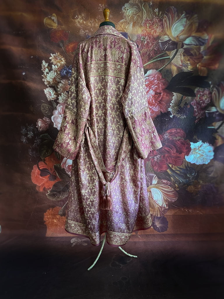 Rose pink and platinum lightweight luxury silk wrapper robe with wide sleeves, large patch pockets and tassel sash. Bohemian style created from antique and vintage textiles by the Pavilion Parade studio.