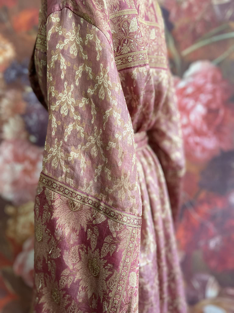 Rose pink and platinum lightweight luxury silk wrapper robe with wide sleeves, large patch pockets and tassel sash. Bohemian style created from antique and vintage textiles by the Pavilion Parade studio.