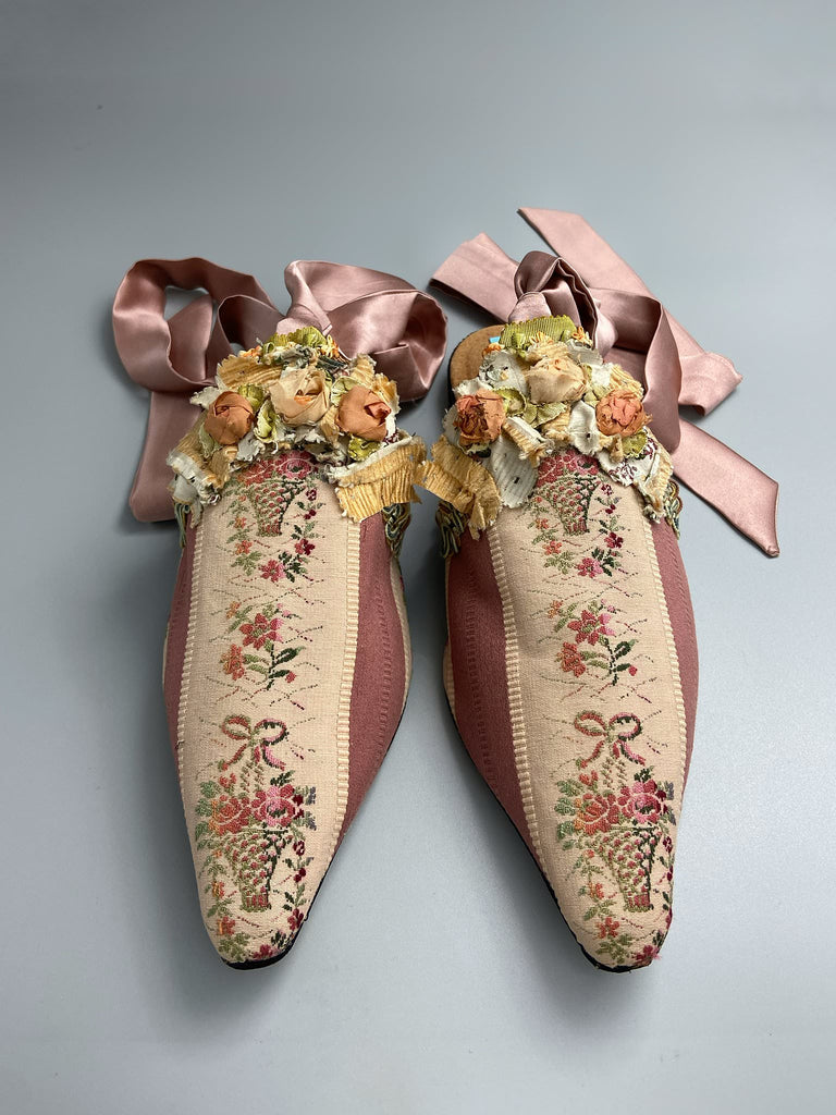 Mauve pink and cream silk pointed toe shoes with antique C18th pinked dress trim and timeworn ribbon roses in the Georgian style. Embellished with antique braids. Bohemian styles sustainably created from antique textiles by Pavilion Parade.