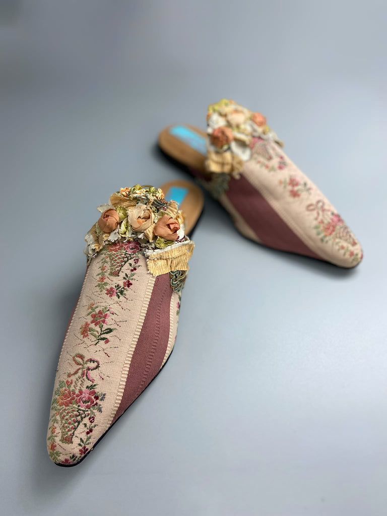 Mauve pink and cream silk pointed toe shoes with antique C18th pinked dress trim and timeworn ribbon roses in the Georgian style. Embellished with antique braids. Bohemian styles sustainably created from antique textiles by Pavilion Parade.