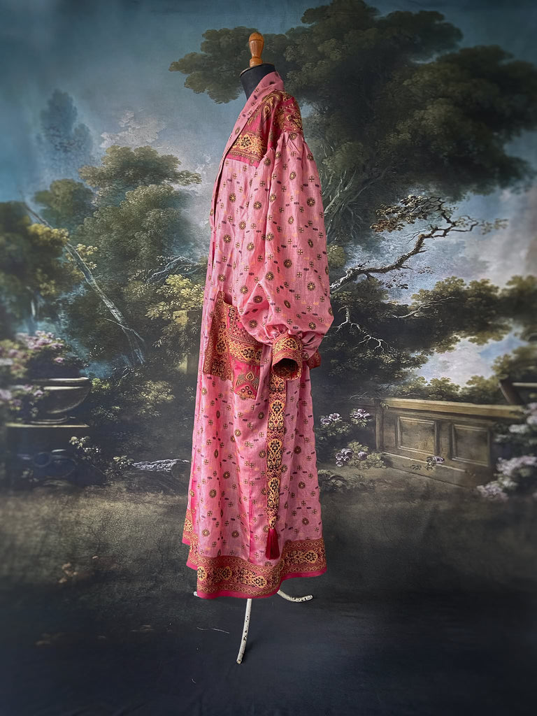 Rose pink and carmine lightweight silk wrapper robe with full sleeves, large patch pockets and tassel sash. Bohemian style created from antique and vintage textiles by the Pavilion Parade studio.