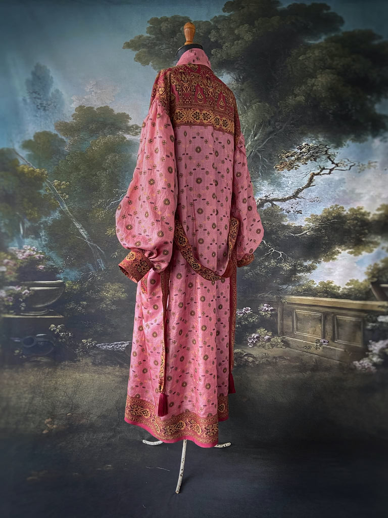 Rose pink and carmine lightweight silk wrapper robe with full sleeves, large patch pockets and tassel sash. Bohemian style created from antique and vintage textiles by the Pavilion Parade studio.