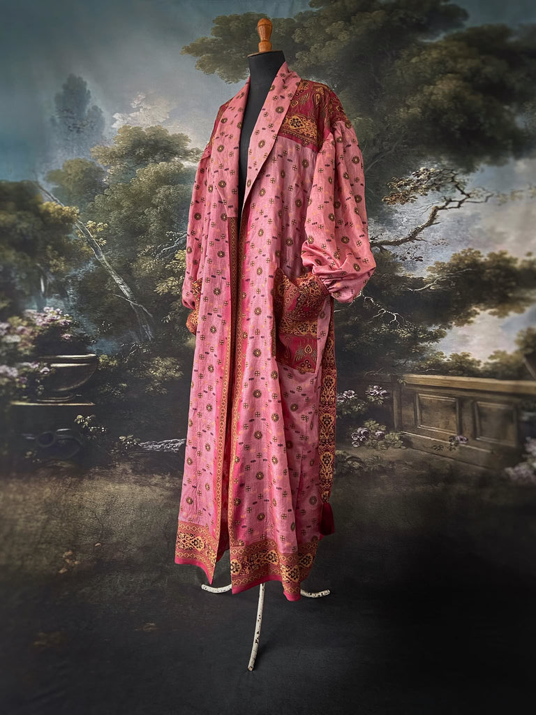 Rose pink and carmine lightweight silk wrapper robe with full sleeves, large patch pockets and tassel sash. Bohemian style created from antique and vintage textiles by the Pavilion Parade studio.