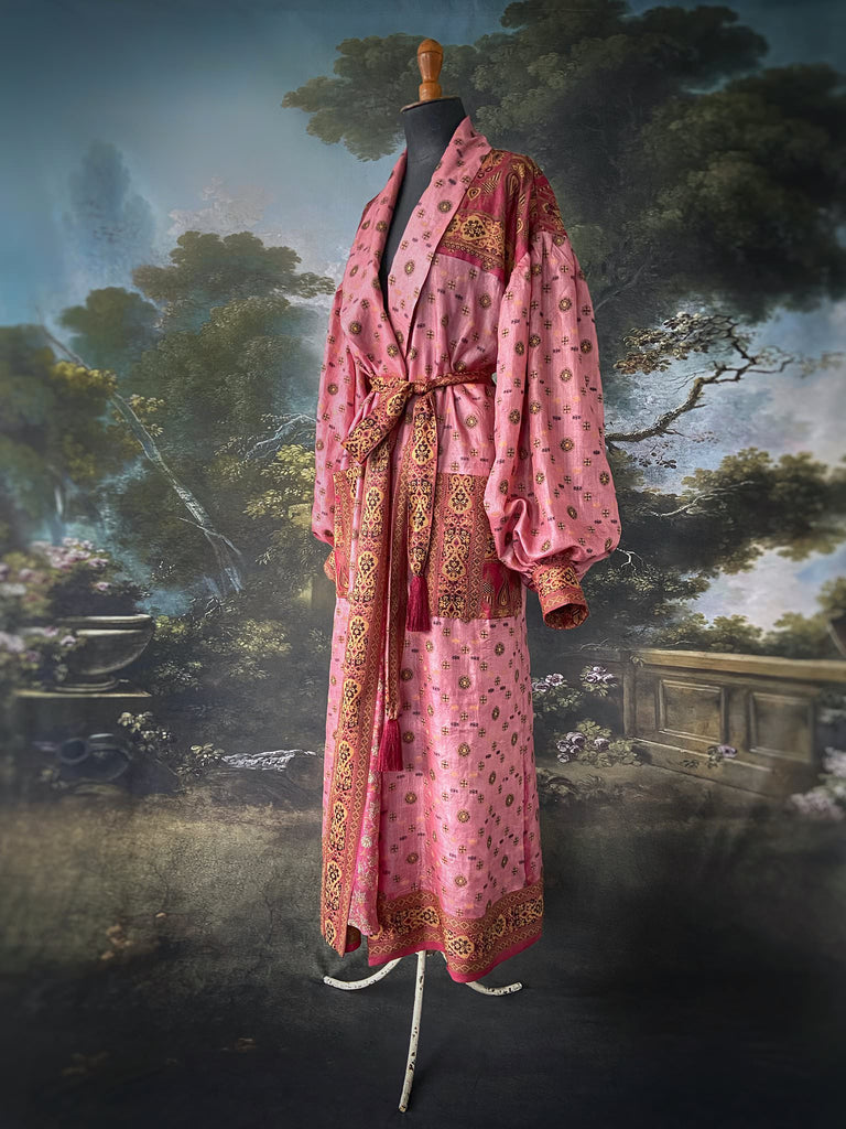 Rose pink and carmine lightweight silk wrapper robe with full sleeves, large patch pockets and tassel sash. Bohemian style created from antique and vintage textiles by the Pavilion Parade studio.
