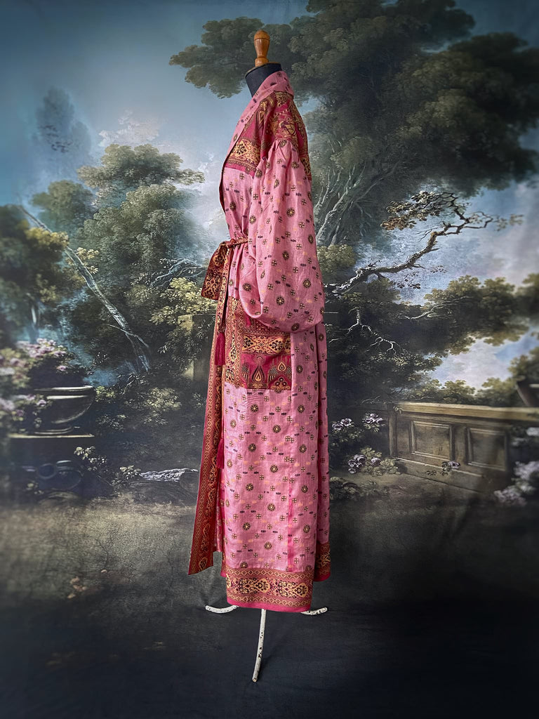 Rose pink and carmine lightweight silk wrapper robe with full sleeves, large patch pockets and tassel sash. Bohemian style created from antique and vintage textiles by the Pavilion Parade studio.
