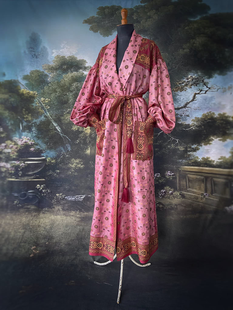 Rose pink and carmine lightweight silk wrapper robe with full sleeves, large patch pockets and tassel sash. Bohemian style created from antique and vintage textiles by the Pavilion Parade studio.