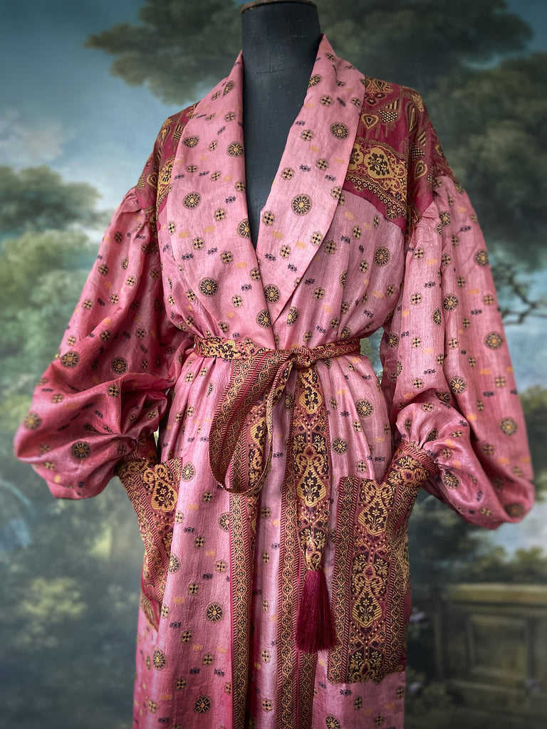 Rose pink and carmine lightweight silk wrapper robe with full sleeves, large patch pockets and tassel sash. Bohemian style created from antique and vintage textiles by the Pavilion Parade studio.