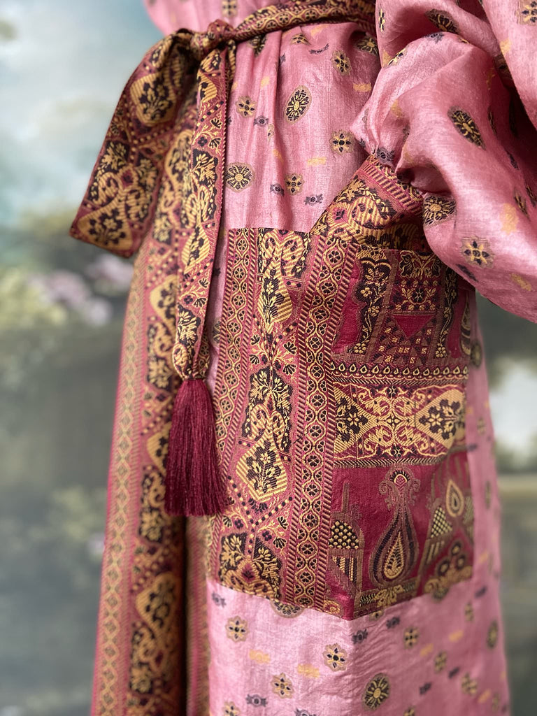 Rose pink and carmine lightweight silk wrapper robe with full sleeves, large patch pockets and tassel sash. Bohemian style created from antique and vintage textiles by the Pavilion Parade studio.
