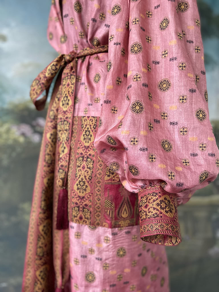 Rose pink and carmine lightweight silk wrapper robe with full sleeves, large patch pockets and tassel sash. Bohemian style created from antique and vintage textiles by the Pavilion Parade studio.