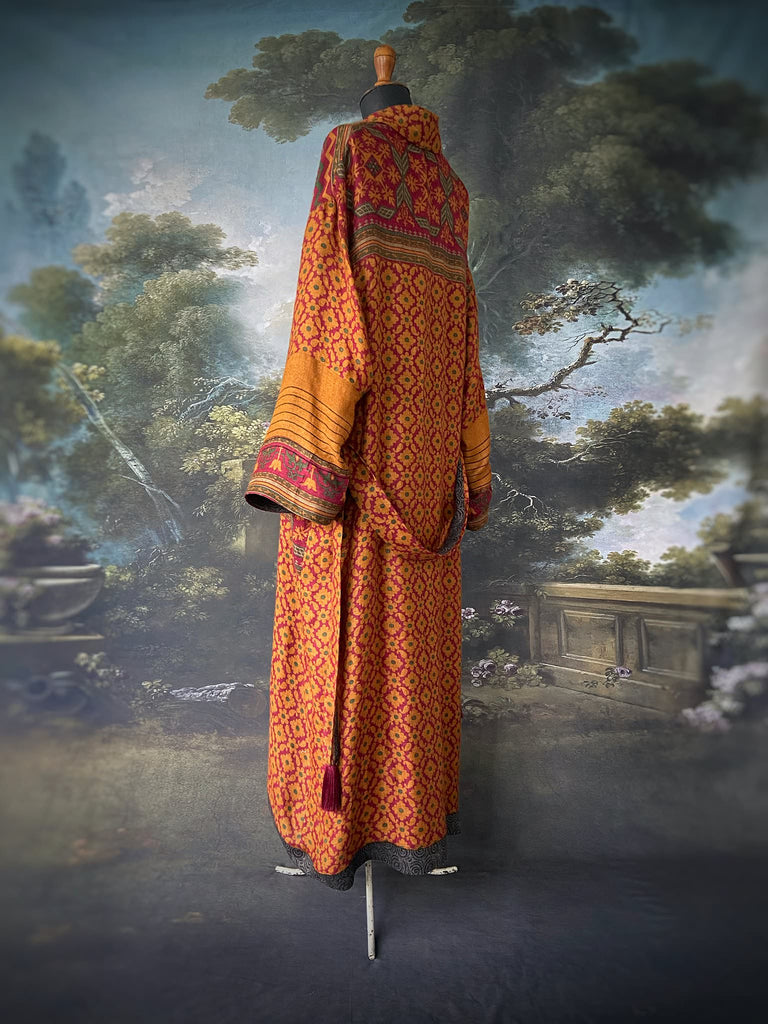 Vibrant saffron and carnelian red fine wool and silk robe with wide sleeves, patch pockets and tassel sash. Bohemian style created from antique and vintage textiles by the Pavilion Parade Studio