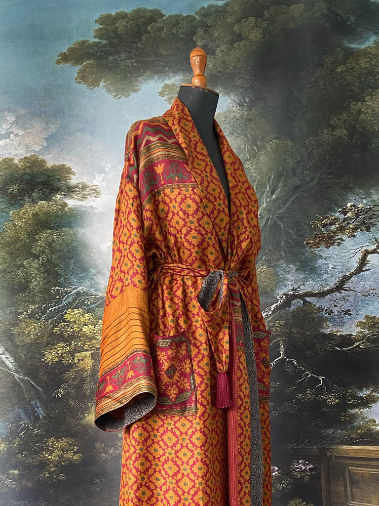 Vibrant saffron and carnelian red fine wool and silk robe with wide sleeves, patch pockets and tassel sash. Bohemian style created from antique and vintage textiles by the Pavilion Parade Studio