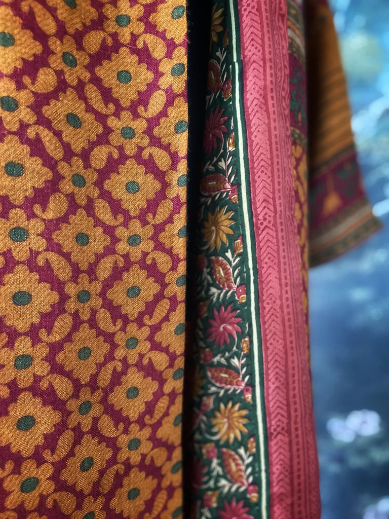 Vibrant saffron and carnelian red fine wool and silk robe with wide sleeves, patch pockets and tassel sash. Bohemian style created from antique and vintage textiles by the Pavilion Parade Studio