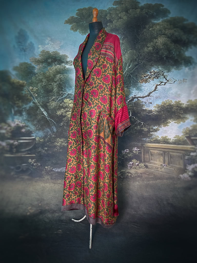 Vibrant ruby red, emerald green, and saffron fine wool robe with block printed paisley boteh pure silk lining. Wide sleeves, deep pockets and tassel sash belt. Bohemian style created from vintage and antique textiles by the Pavilion Parade studio