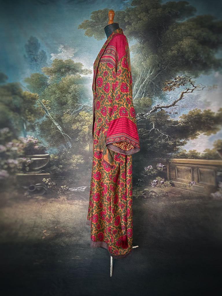 Vibrant ruby red, emerald green, and saffron fine wool robe with block printed paisley boteh pure silk lining. Wide sleeves, deep pockets and tassel sash belt. Bohemian style created from vintage and antique textiles by the Pavilion Parade studio