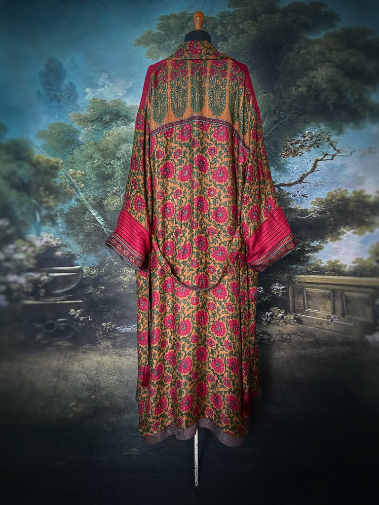 Vibrant ruby red, emerald green, and saffron fine wool robe with block printed paisley boteh pure silk lining. Wide sleeves, deep pockets and tassel sash belt. Bohemian style created from vintage and antique textiles by the Pavilion Parade studio