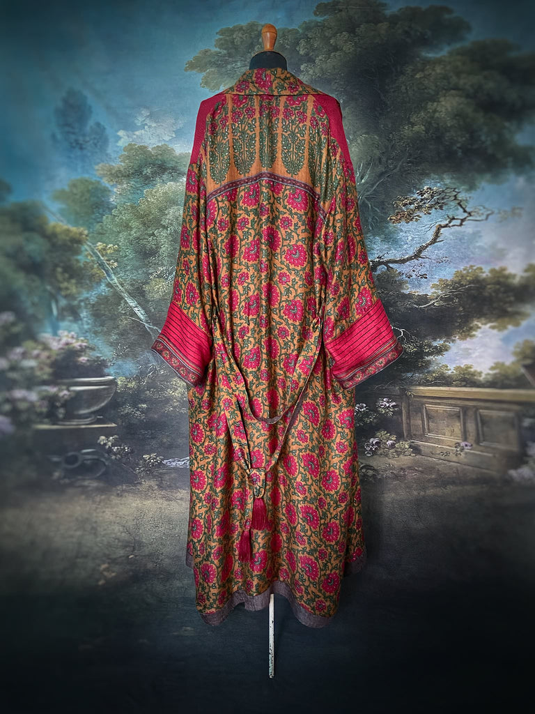 Vibrant ruby red, emerald green, and saffron fine wool robe with block printed paisley boteh pure silk lining. Wide sleeves, deep pockets and tassel sash belt. Bohemian style created from vintage and antique textiles by the Pavilion Parade studio