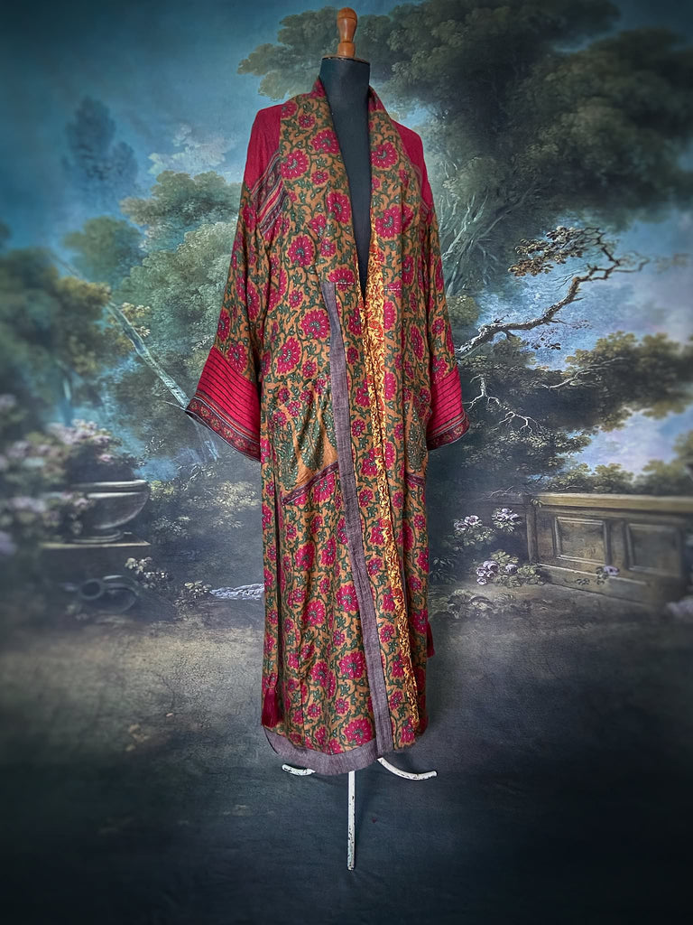 Vibrant ruby red, emerald green, and saffron fine wool robe with block printed paisley boteh pure silk lining. Wide sleeves, deep pockets and tassel sash belt. Bohemian style created from vintage and antique textiles by the Pavilion Parade studio