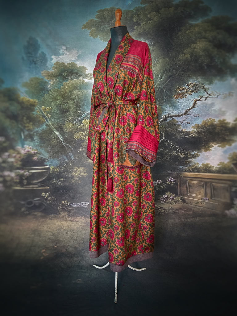 Vibrant ruby red, emerald green, and saffron fine wool robe with block printed paisley boteh pure silk lining. Wide sleeves, deep pockets and tassel sash belt. Bohemian style created from vintage and antique textiles by the Pavilion Parade studio