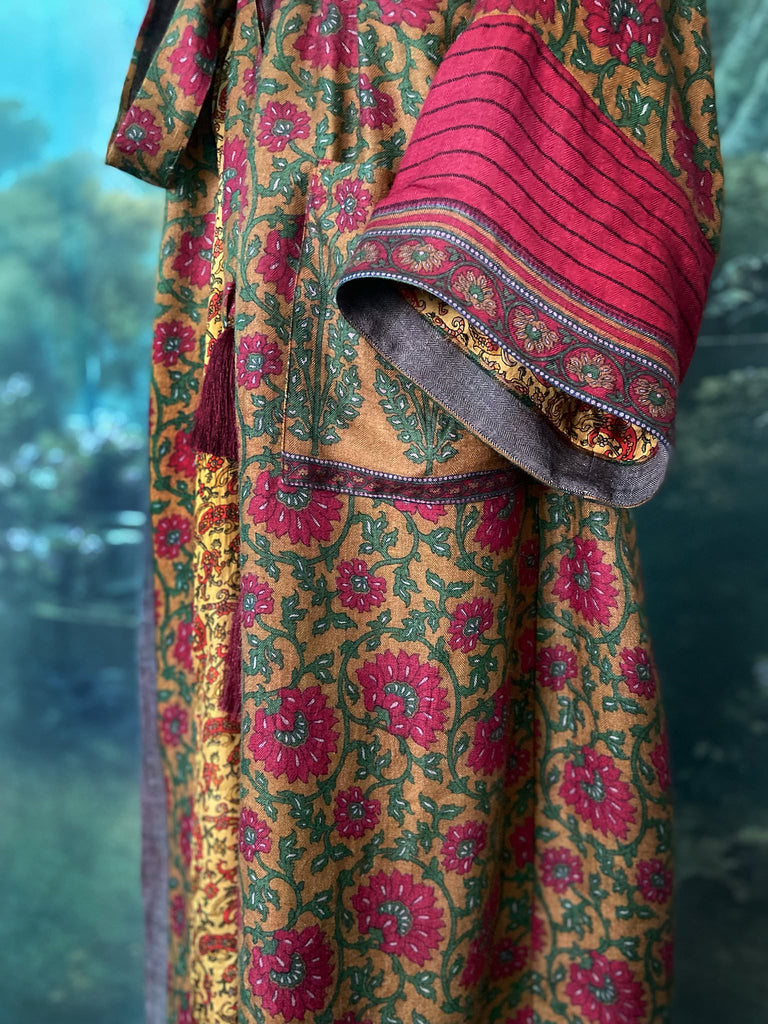Vibrant ruby red, emerald green, and saffron fine wool robe with block printed paisley boteh pure silk lining. Wide sleeves, deep pockets and tassel sash belt. Bohemian style created from vintage and antique textiles by the Pavilion Parade studio