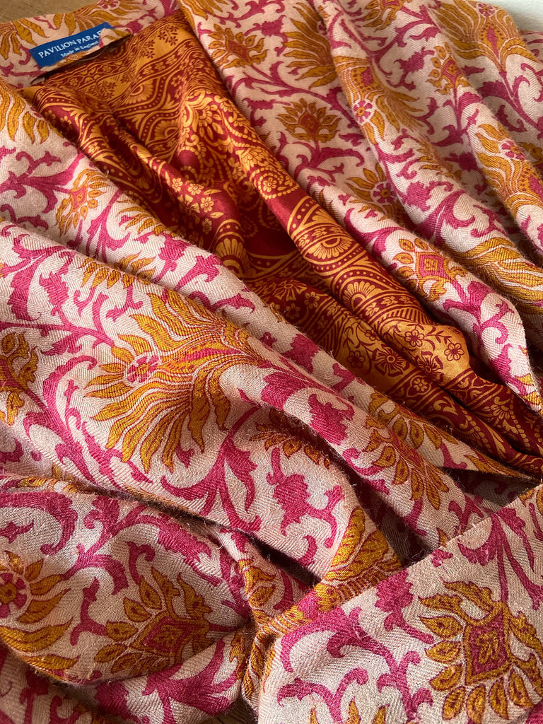 Saffron and hot pink fine wool dressing robe lined with silk. Wide sleeves, patch pockets and tassel sash belt. Bohemian styles sustainably created from antique and vintage textiles by the Pavilion Parade studio.