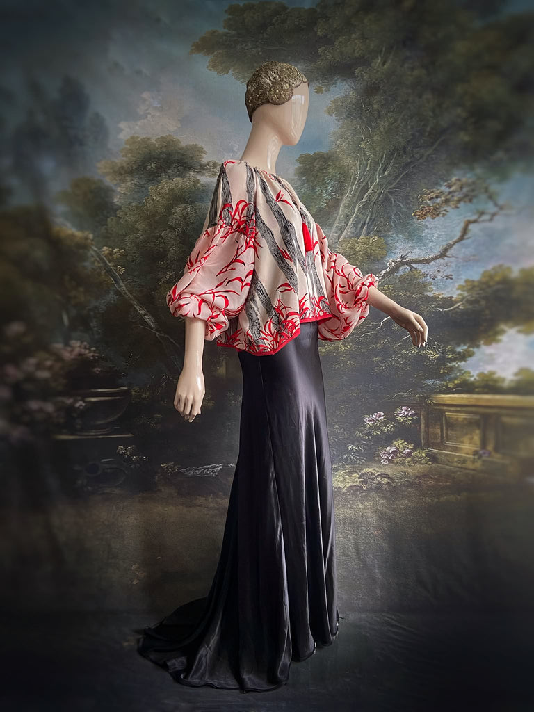 Scarlet, ivory and charcoal grey silk crepe blouse in a 1930s inspired bamboo print, with long full sleeves and adjustable drawstring neckline. Bohemian styles sustainably created from antique and vintage textiles by the Pavilion Parade studio. 