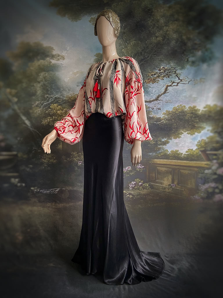 Scarlet, ivory and charcoal grey silk crepe blouse in a 1930s inspired bamboo print, with long full sleeves and adjustable drawstring neckline. Bohemian styles sustainably created from antique and vintage textiles by the Pavilion Parade studio. 
