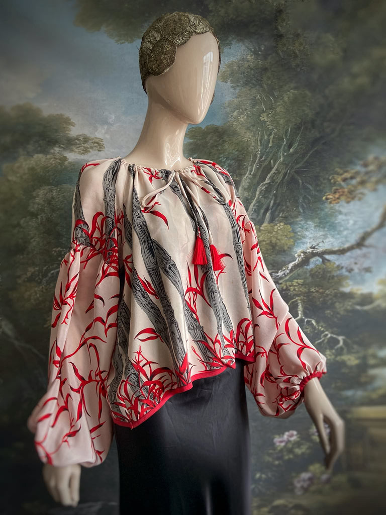 Scarlet, ivory and charcoal grey silk crepe blouse in a 1930s inspired bamboo print, with long full sleeves and adjustable drawstring neckline. Bohemian styles sustainably created from antique and vintage textiles by the Pavilion Parade studio. 