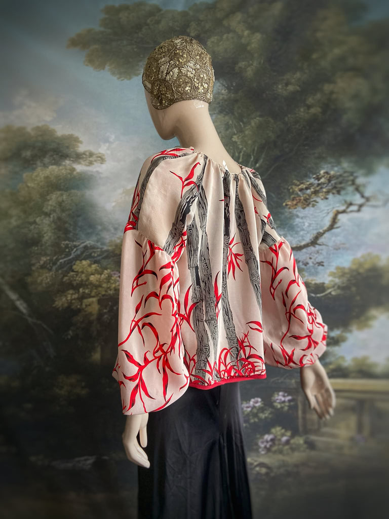 Scarlet, ivory and charcoal grey silk crepe blouse in a 1930s inspired bamboo print, with long full sleeves and adjustable drawstring neckline. Bohemian styles sustainably created from antique and vintage textiles by the Pavilion Parade studio. 