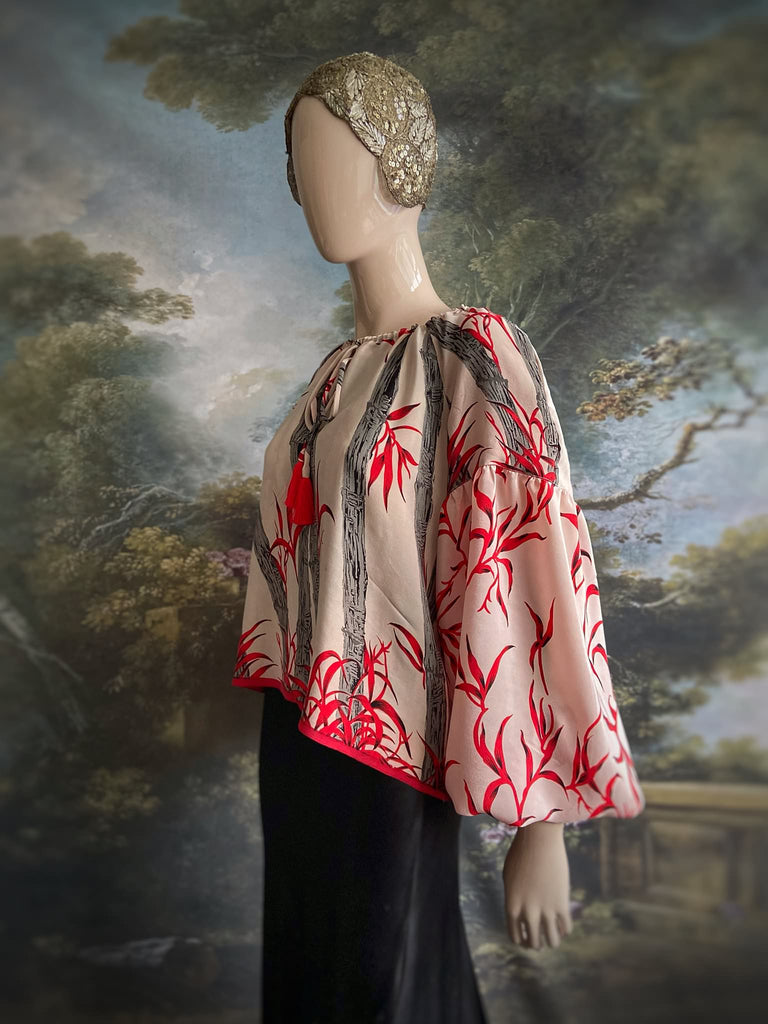 Scarlet, ivory and charcoal grey silk crepe blouse in a 1930s inspired bamboo print, with long full sleeves and adjustable drawstring neckline. Bohemian styles sustainably created from antique and vintage textiles by the Pavilion Parade studio. 
