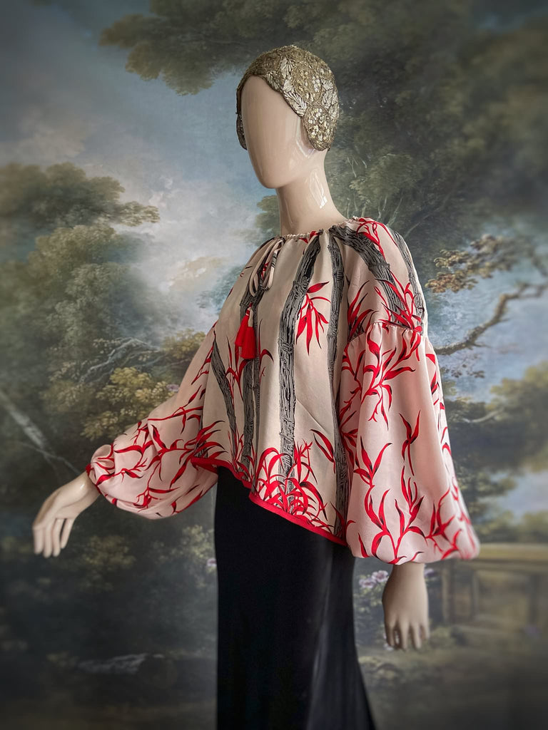 Scarlet, ivory and charcoal grey silk crepe blouse in a 1930s inspired bamboo print, with long full sleeves and adjustable drawstring neckline. Bohemian styles sustainably created from antique and vintage textiles by the Pavilion Parade studio. 