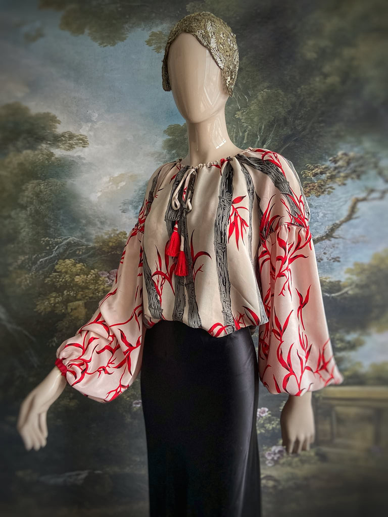 Scarlet, ivory and charcoal grey silk crepe blouse in a 1930s inspired bamboo print, with long full sleeves and adjustable drawstring neckline. Bohemian styles sustainably created from antique and vintage textiles by the Pavilion Parade studio. 
