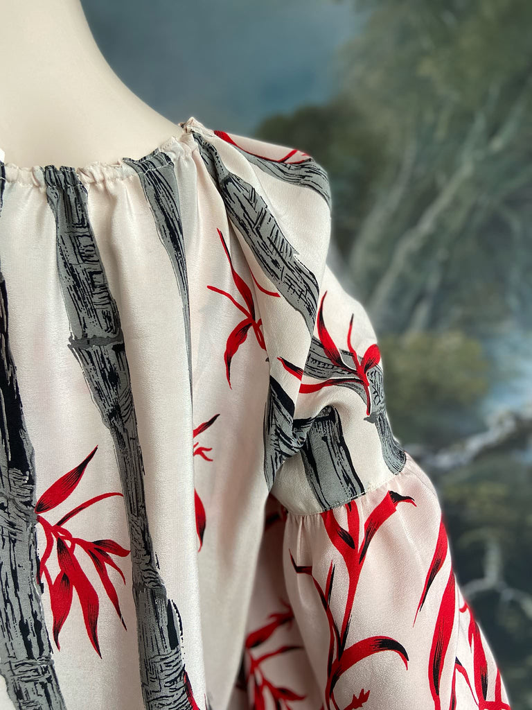 Scarlet, ivory and charcoal grey silk crepe blouse in a 1930s inspired bamboo print, with long full sleeves and adjustable drawstring neckline. Bohemian styles sustainably created from antique and vintage textiles by the Pavilion Parade studio. 