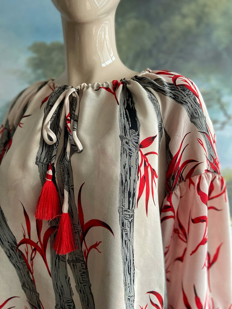 Scarlet, ivory and charcoal grey silk crepe blouse in a 1930s inspired bamboo print, with long full sleeves and adjustable drawstring neckline. Bohemian styles sustainably created from antique and vintage textiles by the Pavilion Parade studio. 