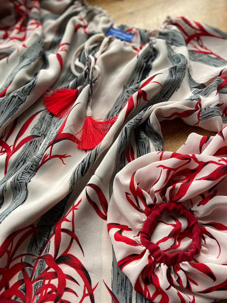Scarlet, ivory and charcoal grey silk crepe blouse in a 1930s inspired bamboo print, with long full sleeves and adjustable drawstring neckline. Bohemian styles sustainably created from antique and vintage textiles by the Pavilion Parade studio. 