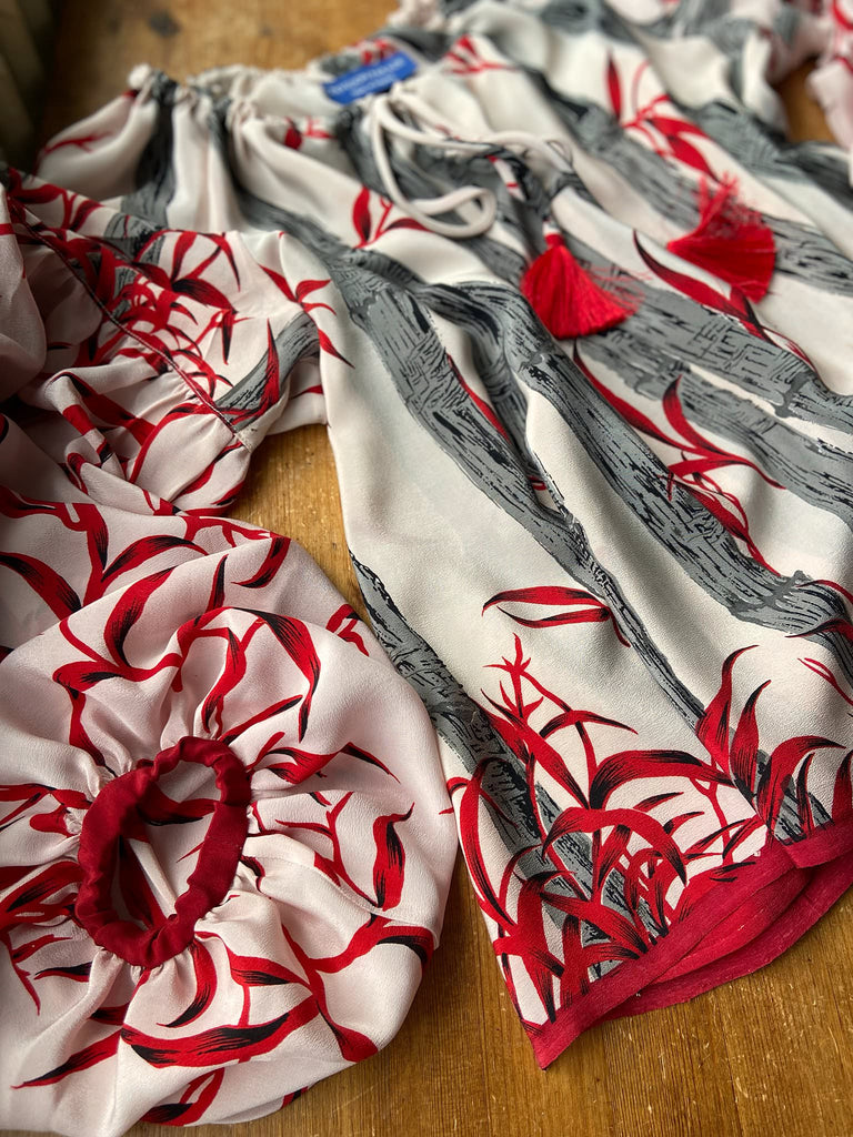 Scarlet, ivory and charcoal grey silk crepe blouse in a 1930s inspired bamboo print, with long full sleeves and adjustable drawstring neckline. Bohemian styles sustainably created from antique and vintage textiles by the Pavilion Parade studio. 