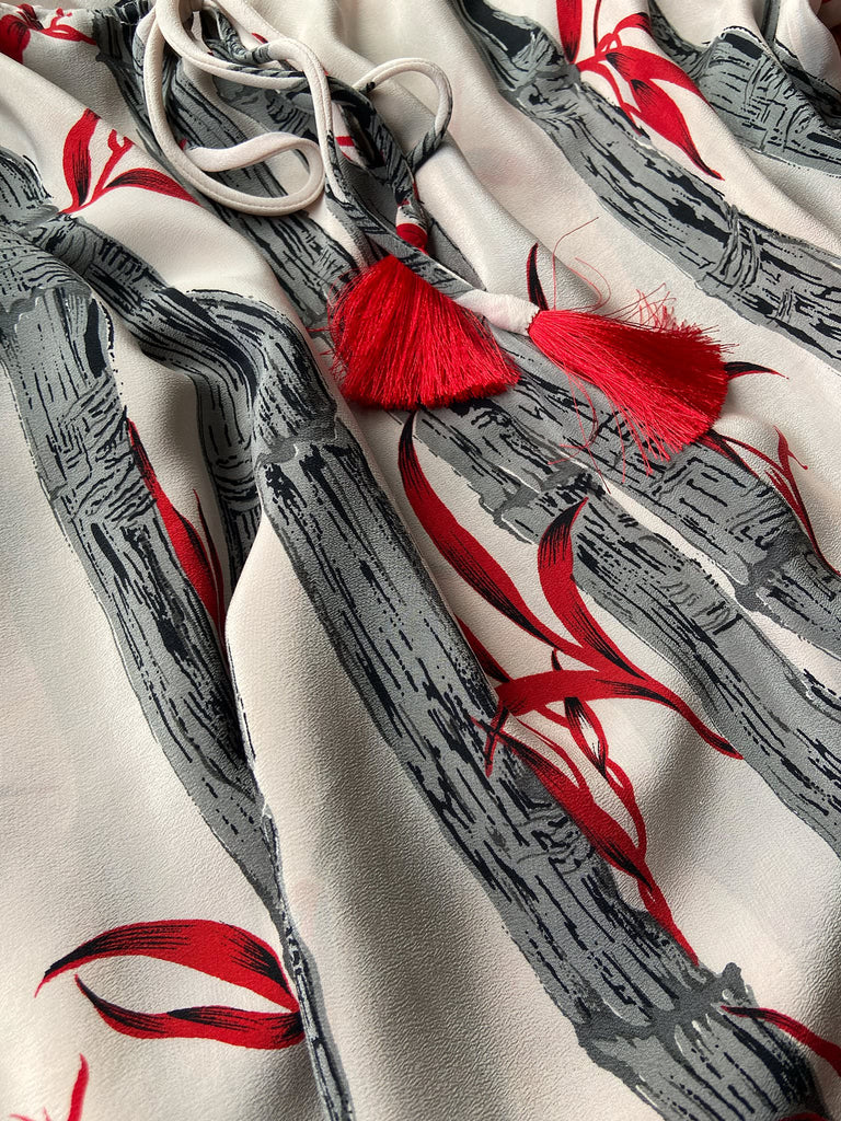 Scarlet, ivory and charcoal grey silk crepe blouse in a 1930s inspired bamboo print, with long full sleeves and adjustable drawstring neckline. Bohemian styles sustainably created from antique and vintage textiles by the Pavilion Parade studio. 