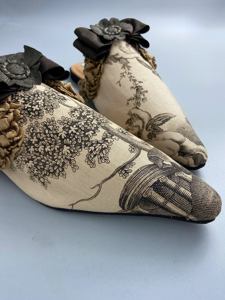 Sepia classical putti cherub pointed toe shoes with silk rosette bows created from antique textiles by Pavilion Parade