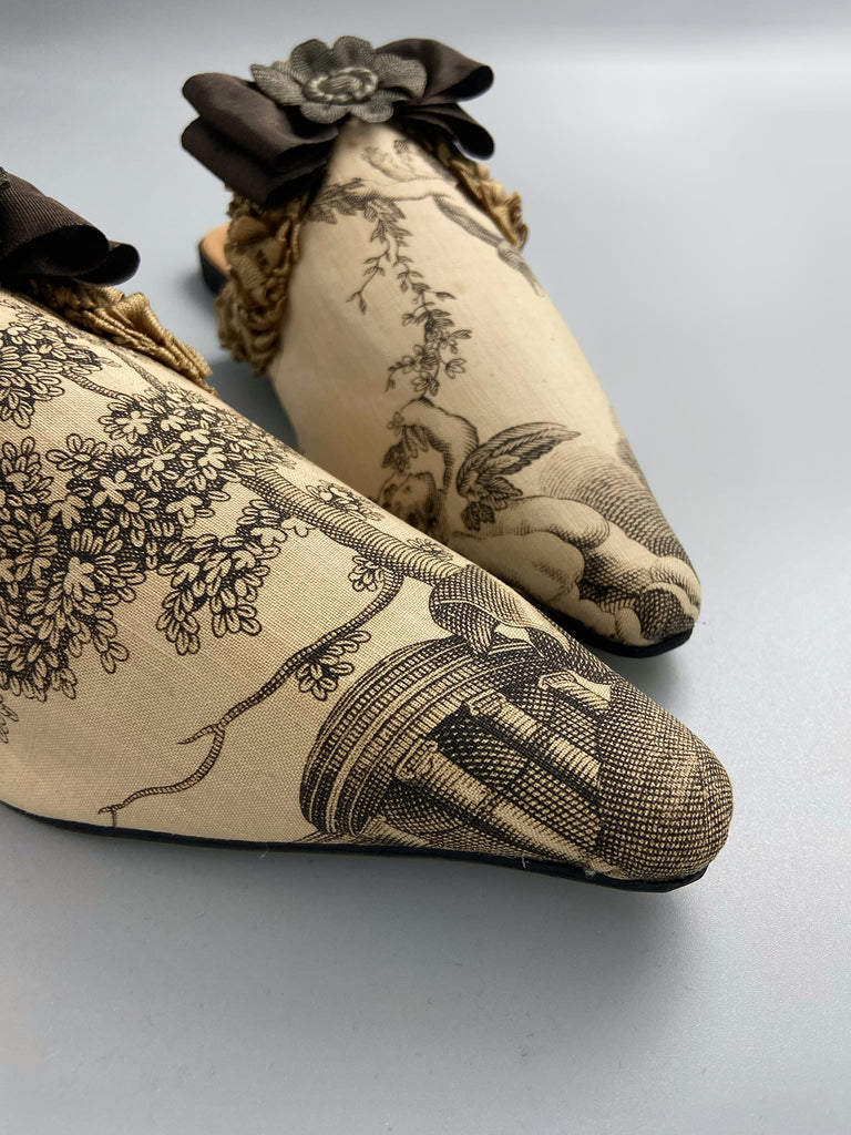 Sepia classical putti cherub pointed toe shoes with silk rosette bows created from antique textiles by Pavilion Parade