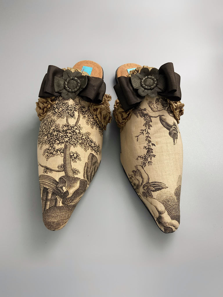 Sepia classical putti cherub pointed toe shoes with silk rosette bows created from antique textiles by Pavilion Parade
