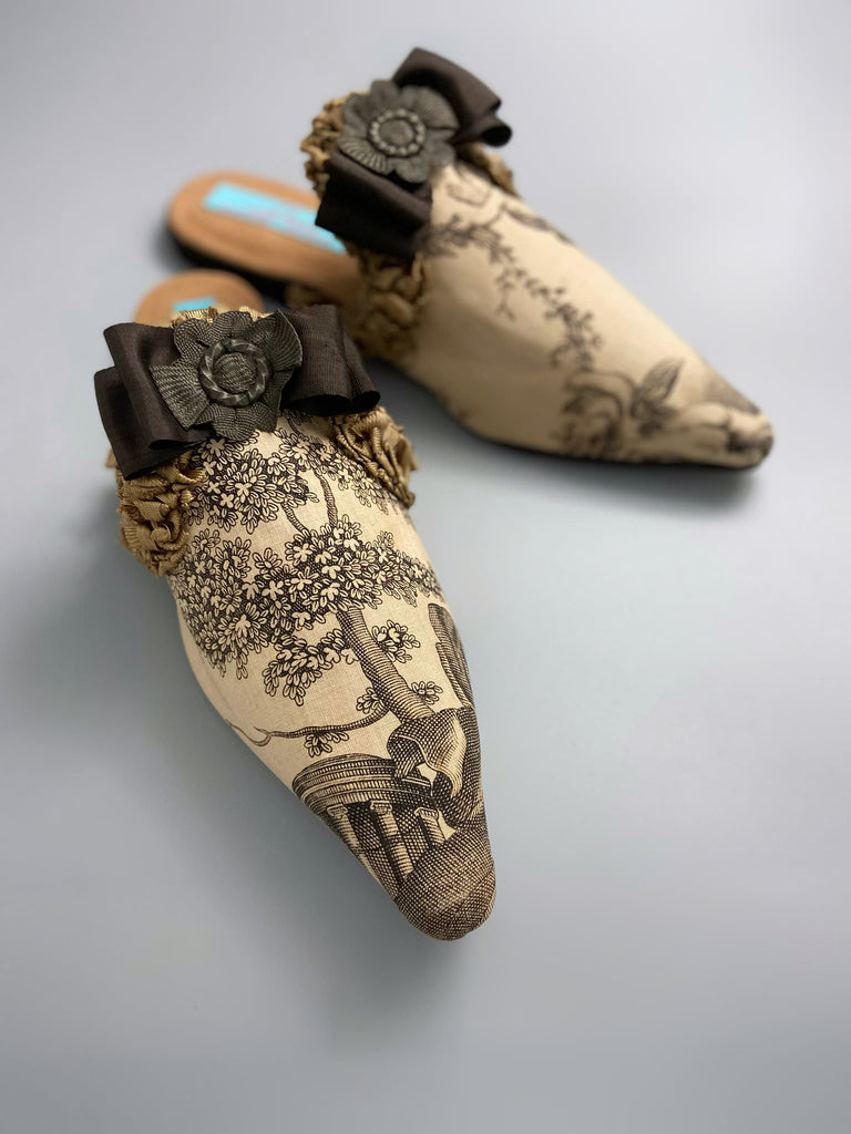 Sepia classical putti cherub pointed toe shoes with silk rosette bows created from antique textiles by Pavilion Parade