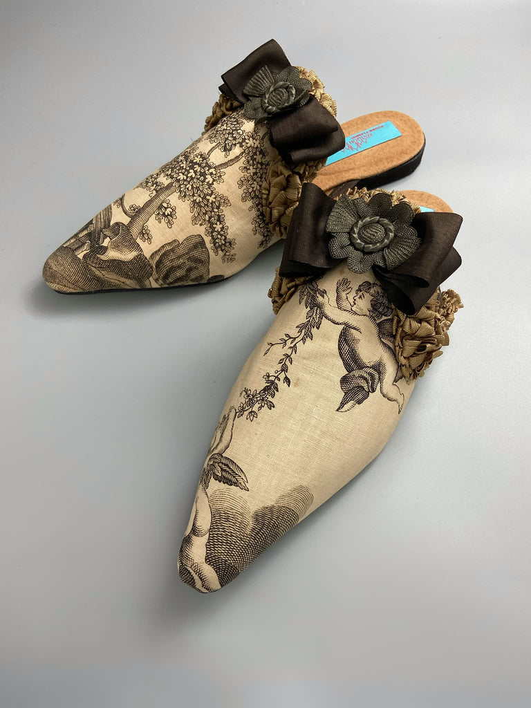 Sepia classical putti cherub pointed toe shoes with silk rosette bows created from antique textiles by Pavilion Parade