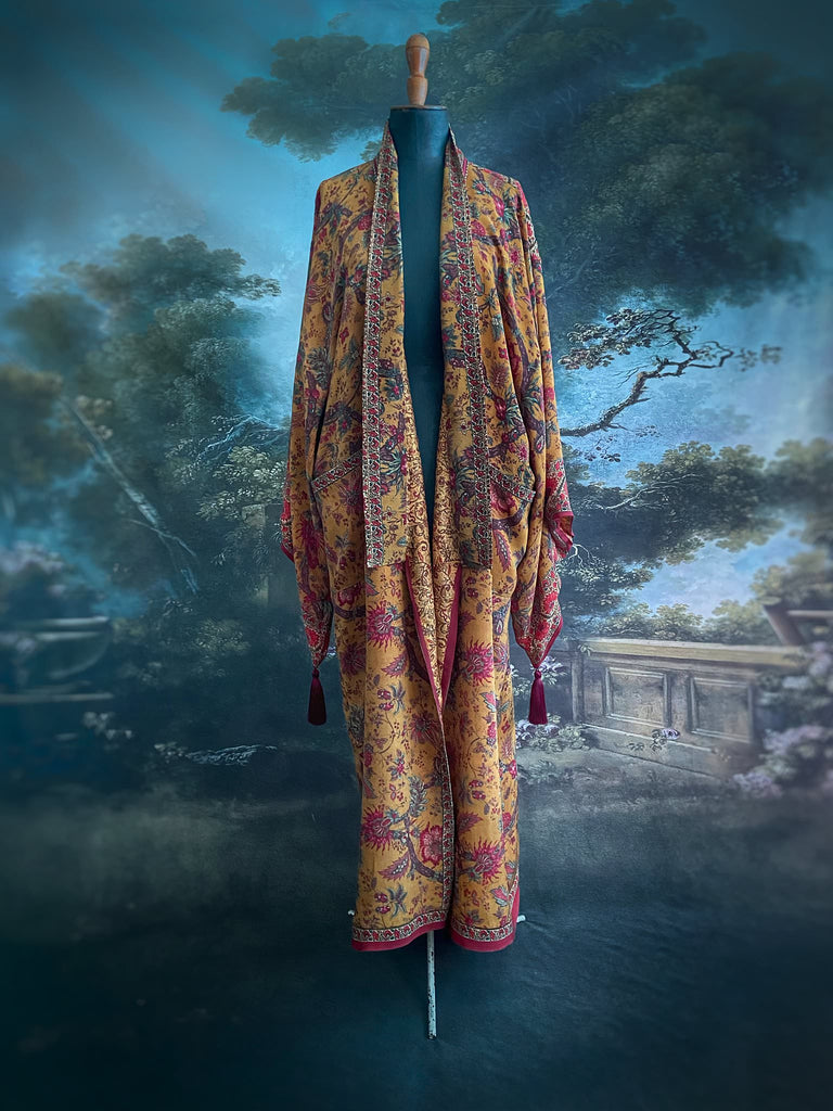 Full length 1920s inspired kimono robe with large patch pockets. Newly created from a saffron and ruby vintage silk crepe. Fully lined in silk with French seams throughout. Bohemian styles sustainably created from antique and vintage textiles by the Pavilion Parade studio.
