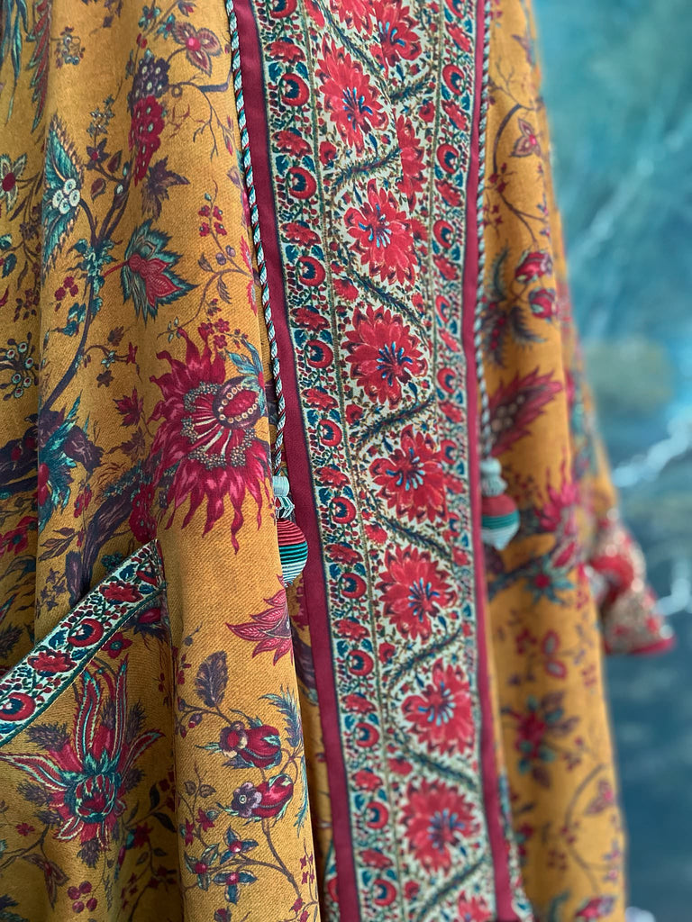 Full length 1920s inspired kimono robe with large patch pockets. Newly created from a saffron and ruby vintage silk crepe. Fully lined in silk with French seams throughout. Bohemian styles sustainably created from antique and vintage textiles by the Pavilion Parade studio.