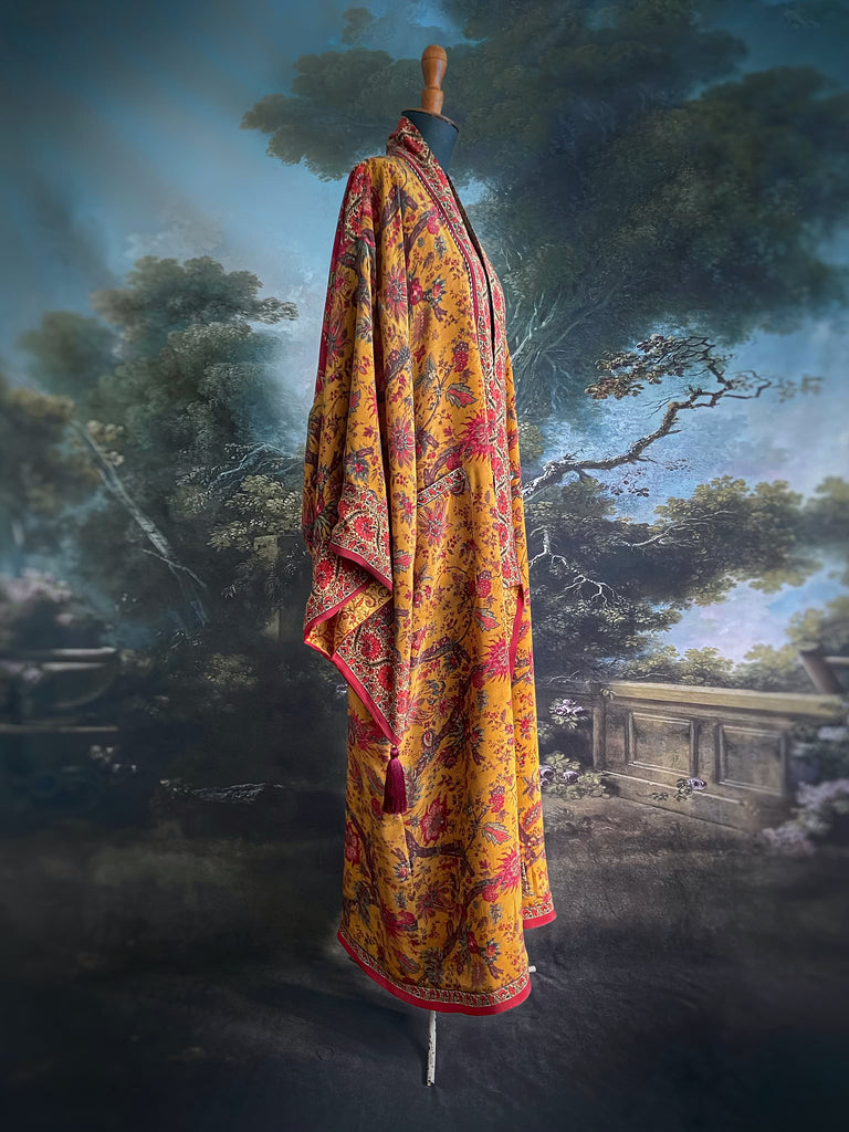 Full length 1920s inspired kimono robe with large patch pockets. Newly created from a saffron and ruby vintage silk crepe. Fully lined in silk with French seams throughout. Bohemian styles sustainably created from antique and vintage textiles by the Pavilion Parade studio.
