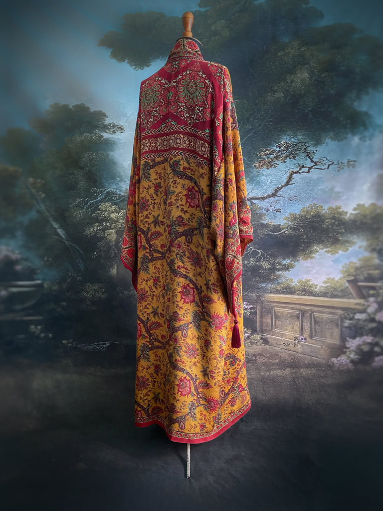 Full length 1920s inspired kimono robe with large patch pockets. Newly created from a saffron and ruby vintage silk crepe. Fully lined in silk with French seams throughout. Bohemian styles sustainably created from antique and vintage textiles by the Pavilion Parade studio.