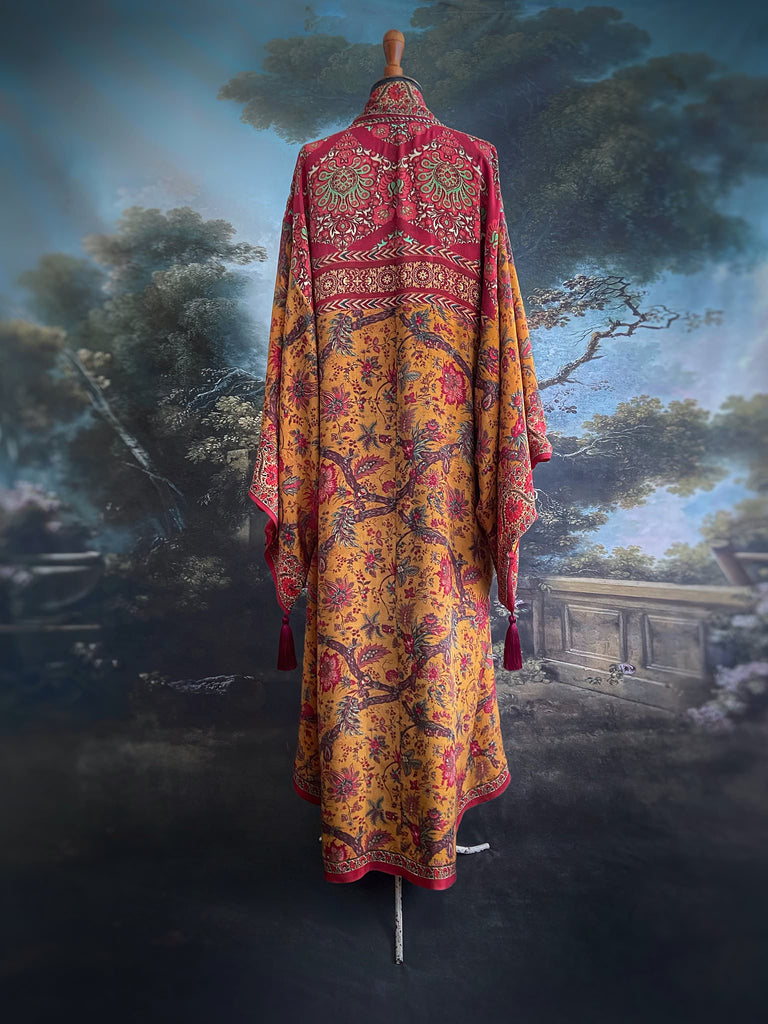 Full length 1920s inspired kimono robe with large patch pockets. Newly created from a saffron and ruby vintage silk crepe. Fully lined in silk with French seams throughout. Bohemian styles sustainably created from antique and vintage textiles by the Pavilion Parade studio.